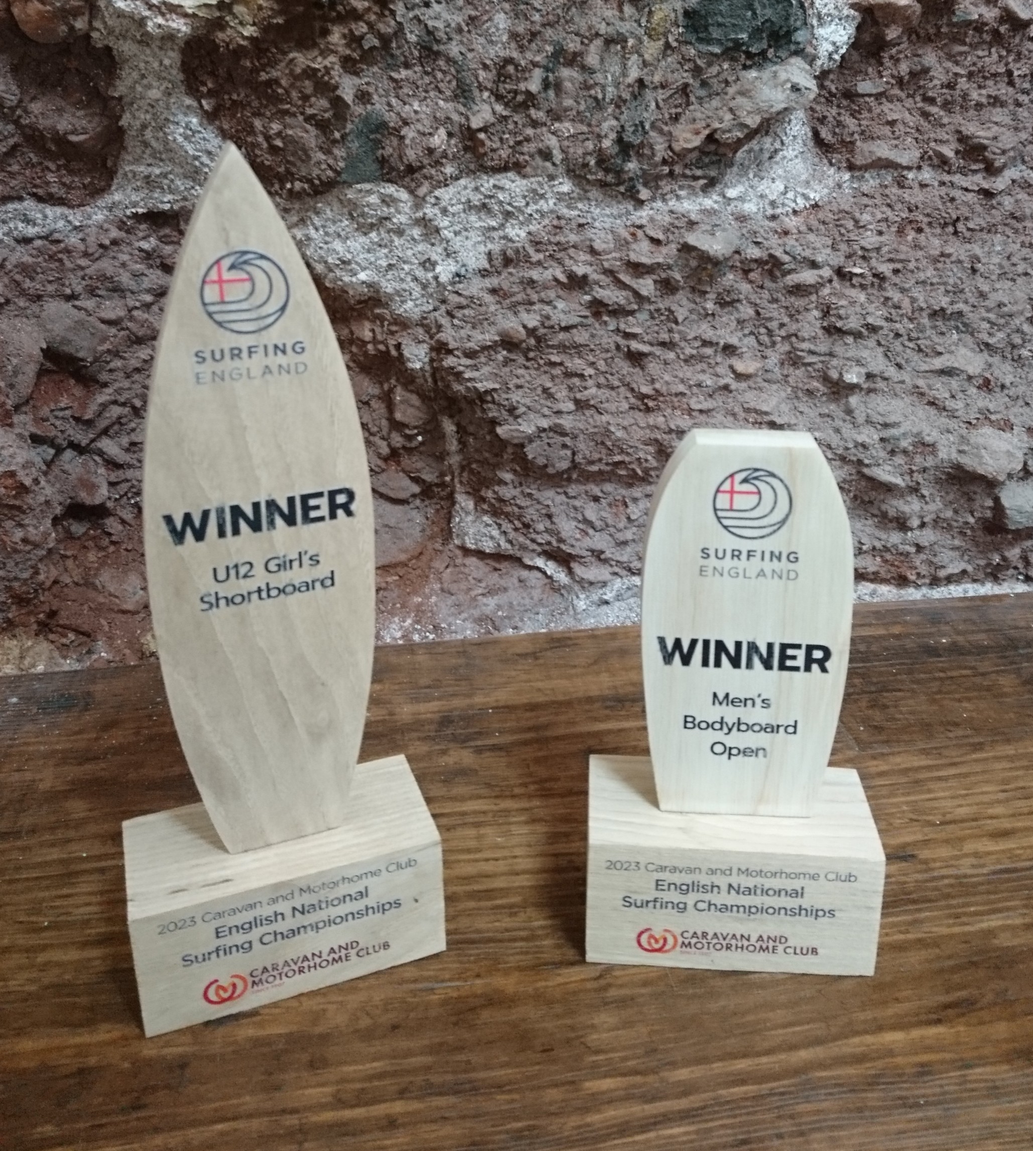Surfing GB trophies. One is in shape of shortboard, one is in shape of bodyboard. Made from maple and details printed in colour