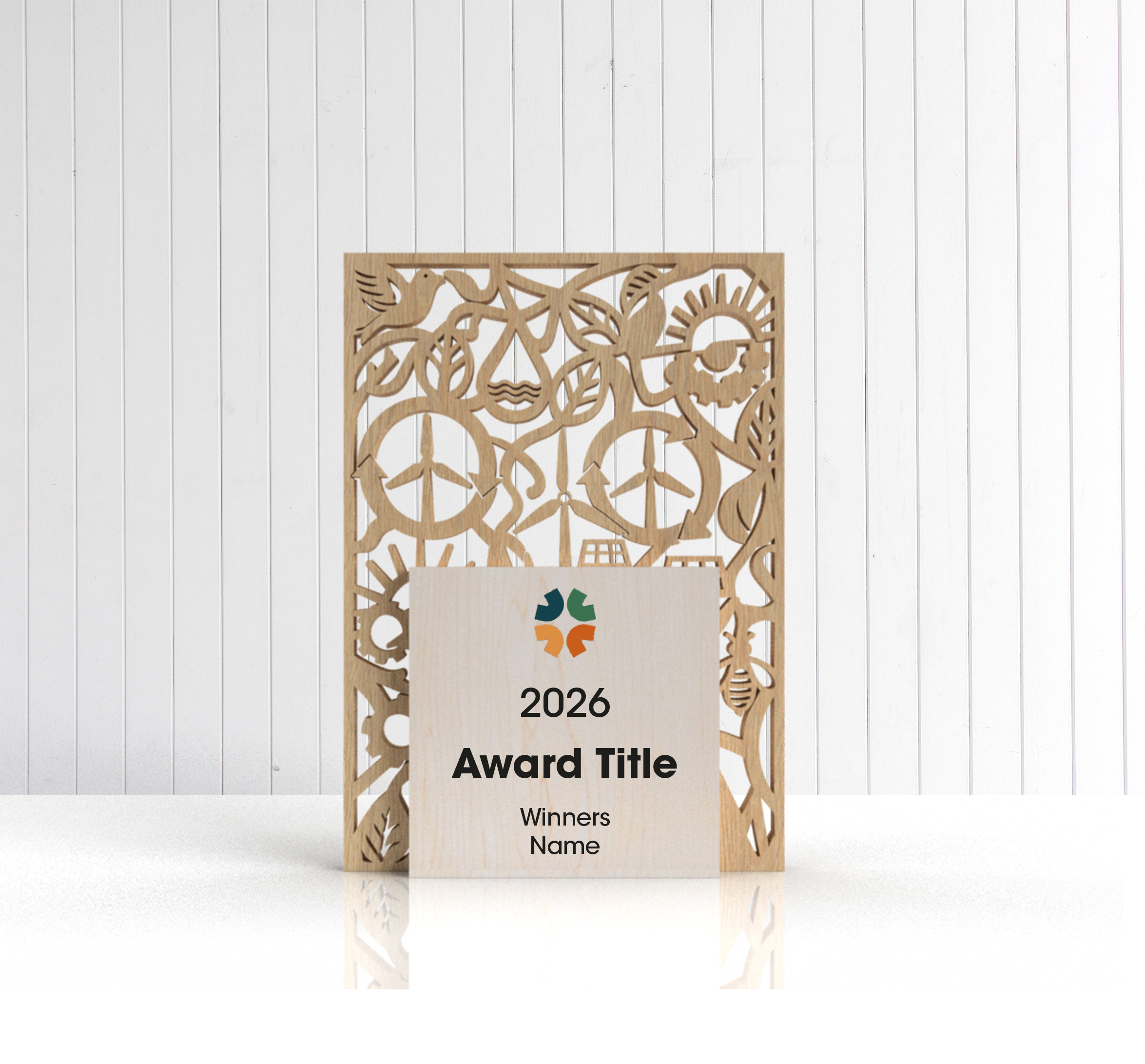 Eco cutout wooden trophy showing laser-cut renewable energy themed centre panel and ash blocks