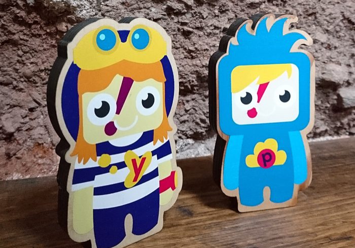 Characters laser cut and printed on wood